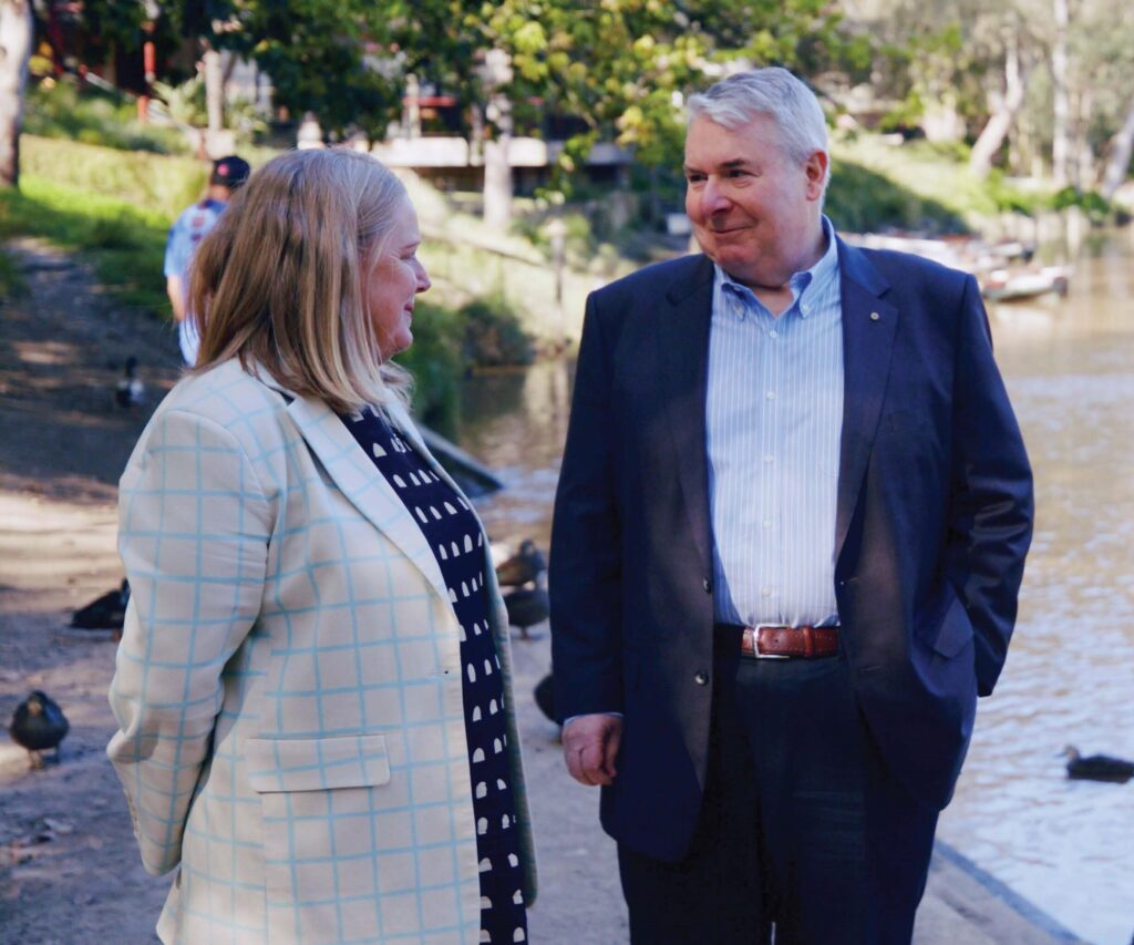 Laura Collister and Michael Gorton standing next to the Yarra River